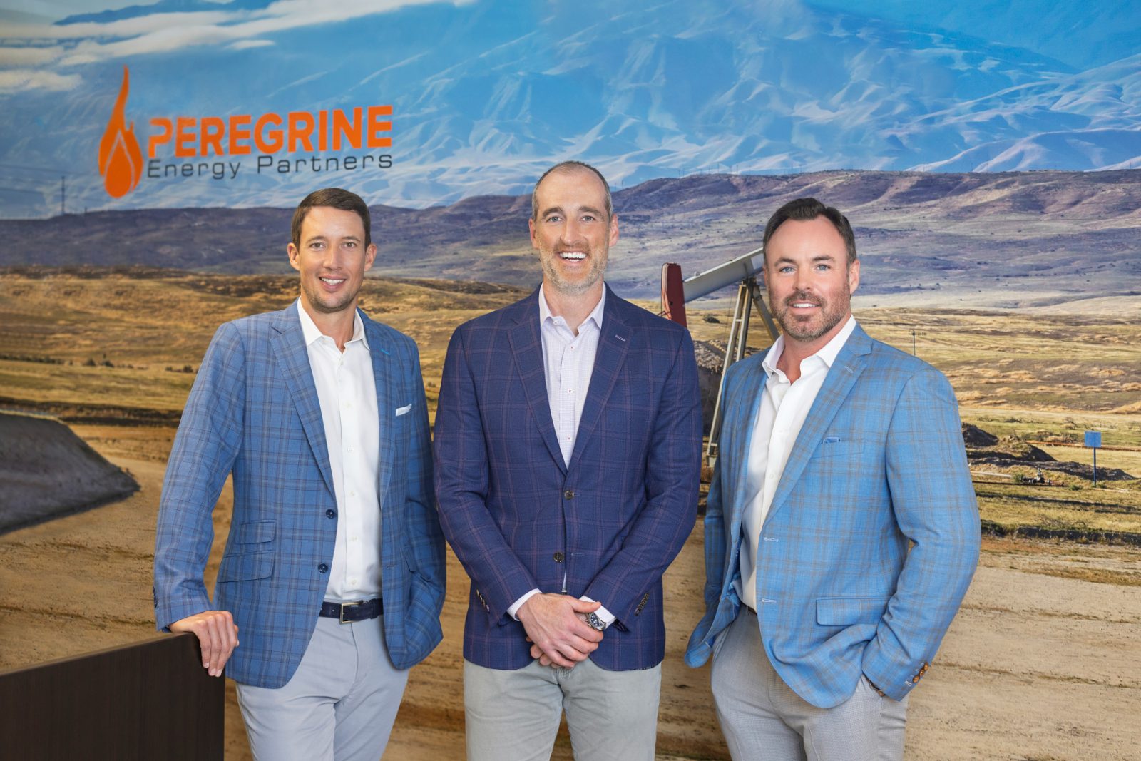Peregrine's three managing partners standing in front of the company landscape backdrop.