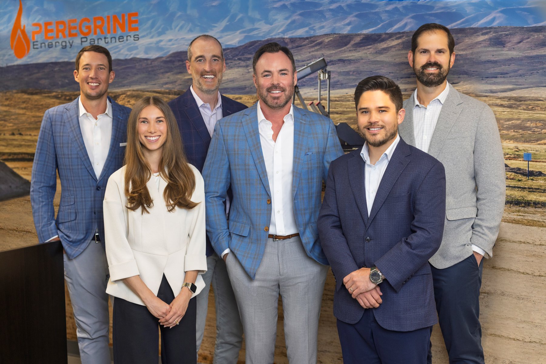 The Peregrine team, Wolf Hanschen, CJ Tibbs, Josh Prier, Cameron Kroese, Matt Jacobs, and Catherine Bradley, photographed together in front of the company landscape backdrop.